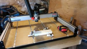 Shapeoko XXL Assembled with t-tracks and first test part.