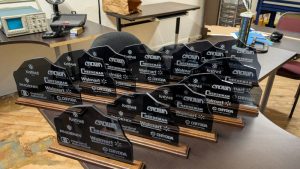 Black acrylic centerpieces representing how these companies are the 'rock' of the Greencastle / Putnam County Developement Center over the years.